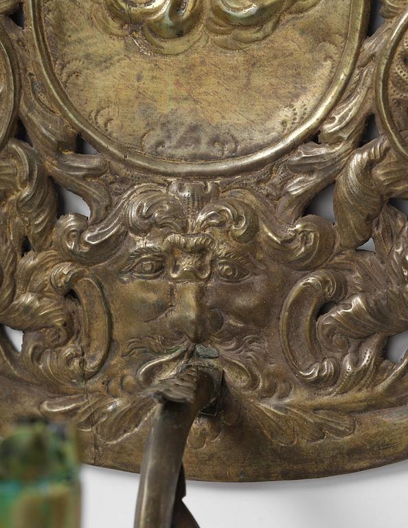 A set of four Swedish Baroque repoussé silvered brass reflector one-branch reflector plates, ca 1690-1700.