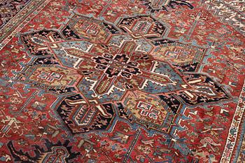 A semi-antique Heris carpet, west persia c. 322 x 252 cm.