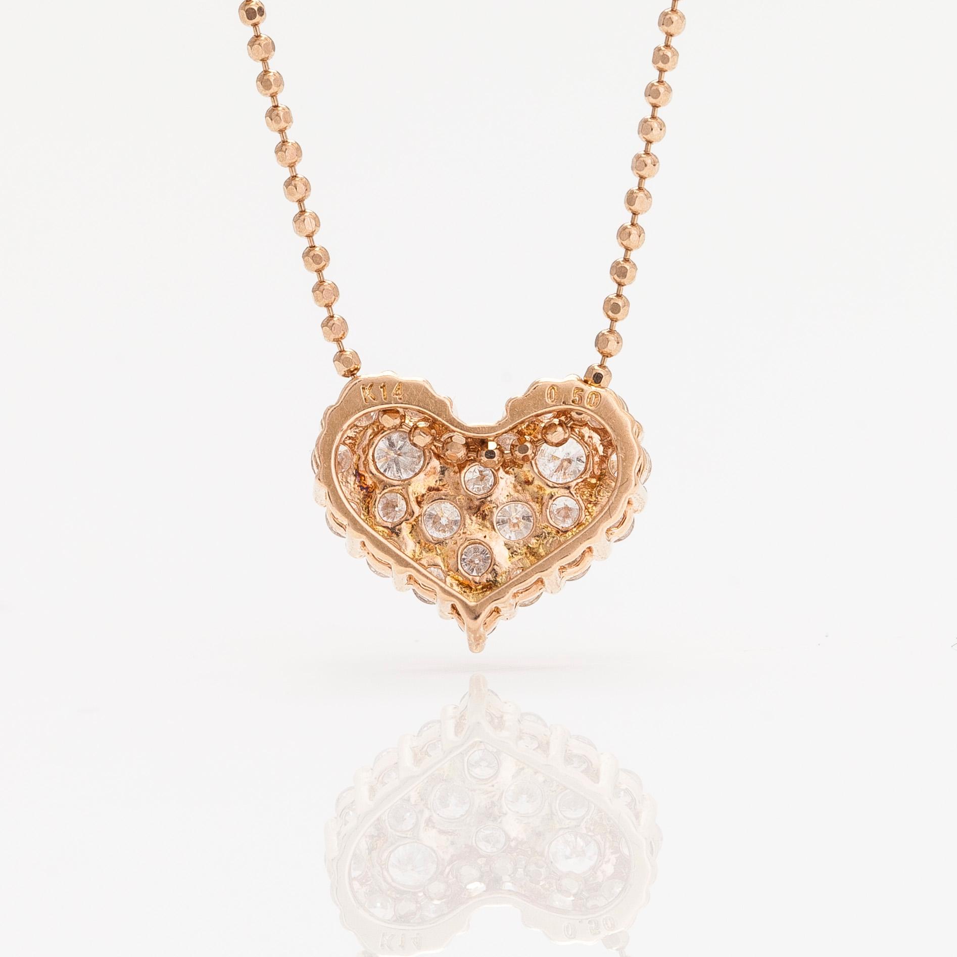 Halsband med hänge i form av hjärta, 14K och 18K roséguld och diamanter ca 0.50 ct.