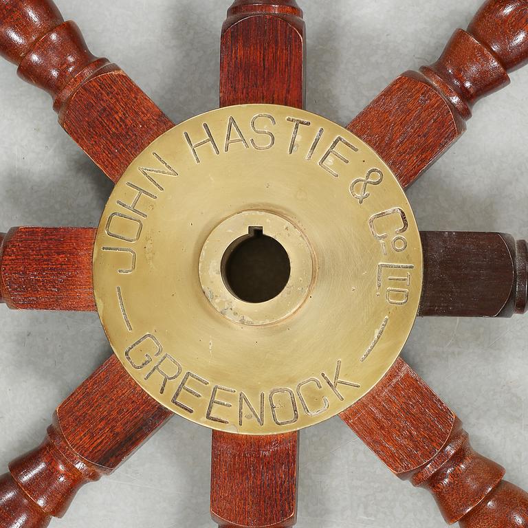 A ship wheel from John Hastie & Co, Greenrock, 20th century.