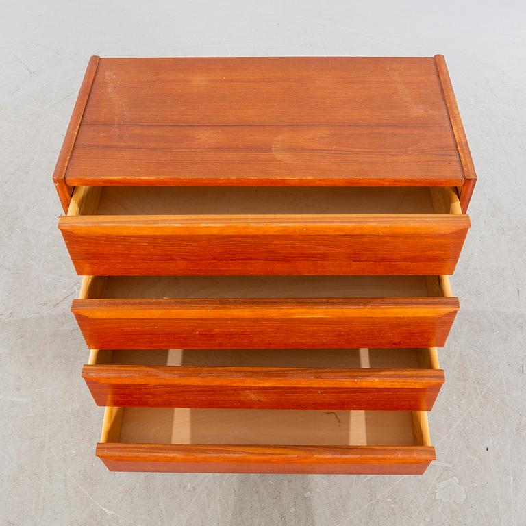 A mid 20th century teak veneered chest of four drawers.