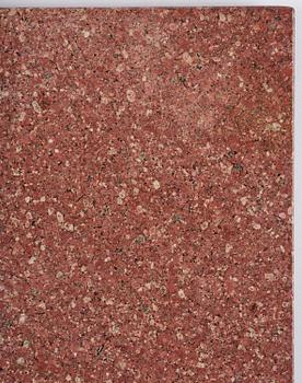 A table with granite stone top from Älvdalen, first part 19th century on a later metal stand.