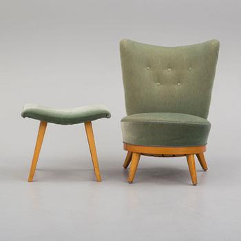 a mid 50th century easy chair with stool.