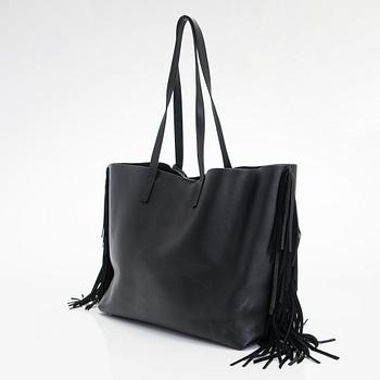 Saint Laurent, a 'Sac shopping' bag.