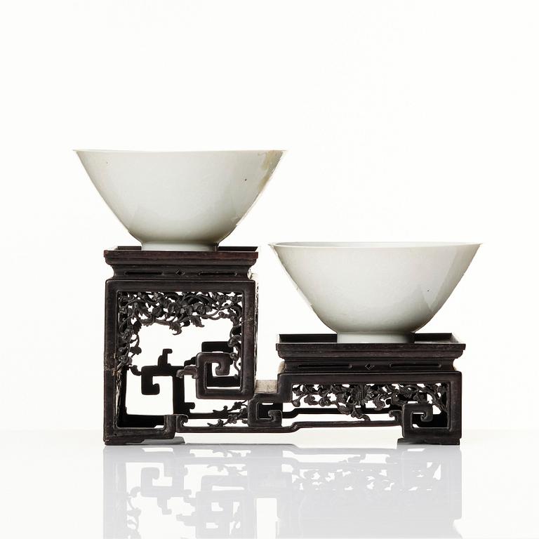 Two Chinese white glazed anhua decorated dragon bowls, Qing dynasty.