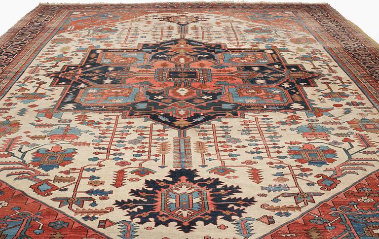 An antique Heriz Serapi carpet, West Persia, c. 616 x 407 cm.