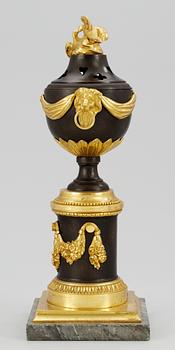 A Louis XVI table urn.