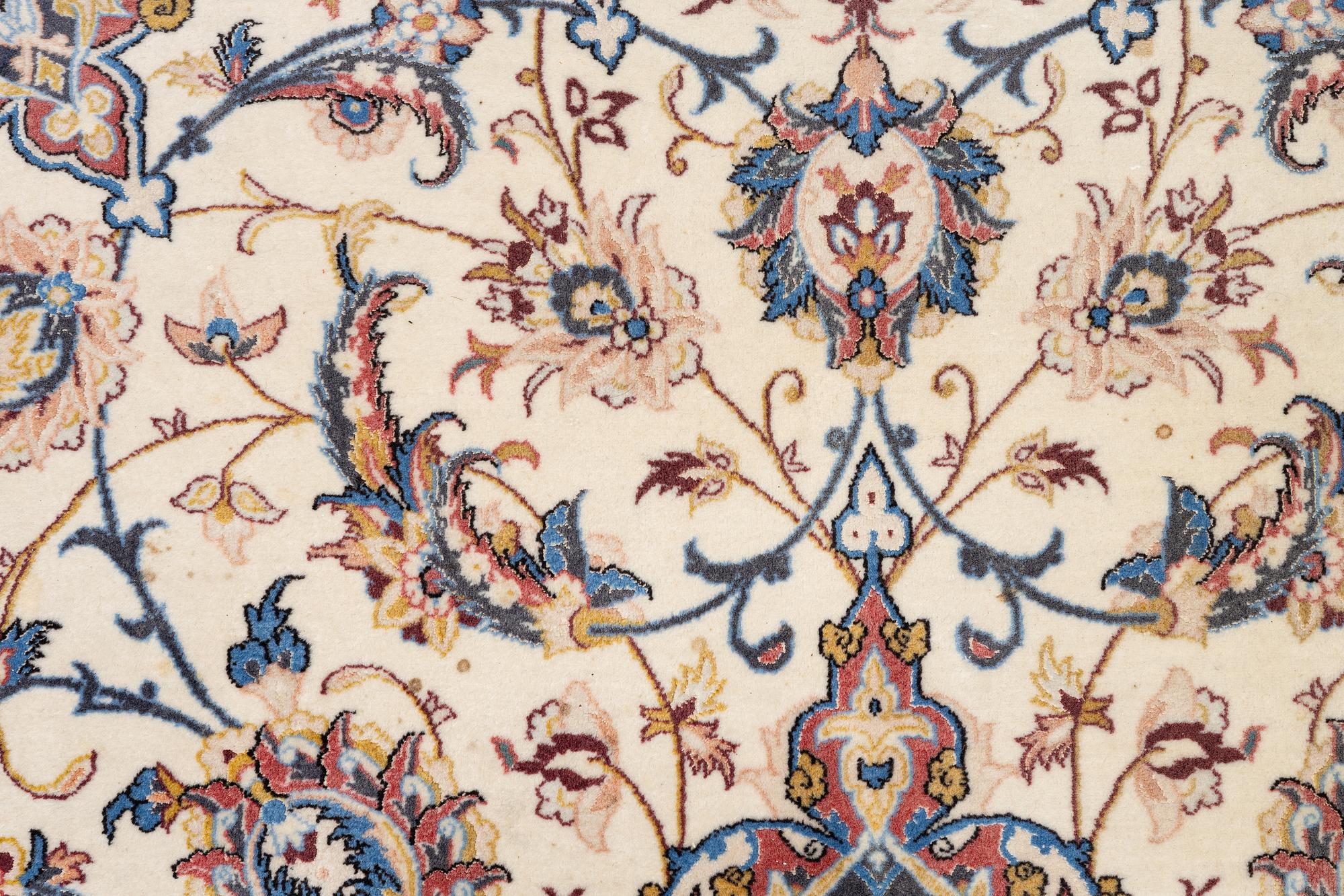 An Isfahan carpet, signed, approx. 372 x 255 cm.