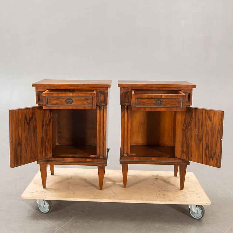A pair of walnut Empire style bedside tables first half of the 20th century.
