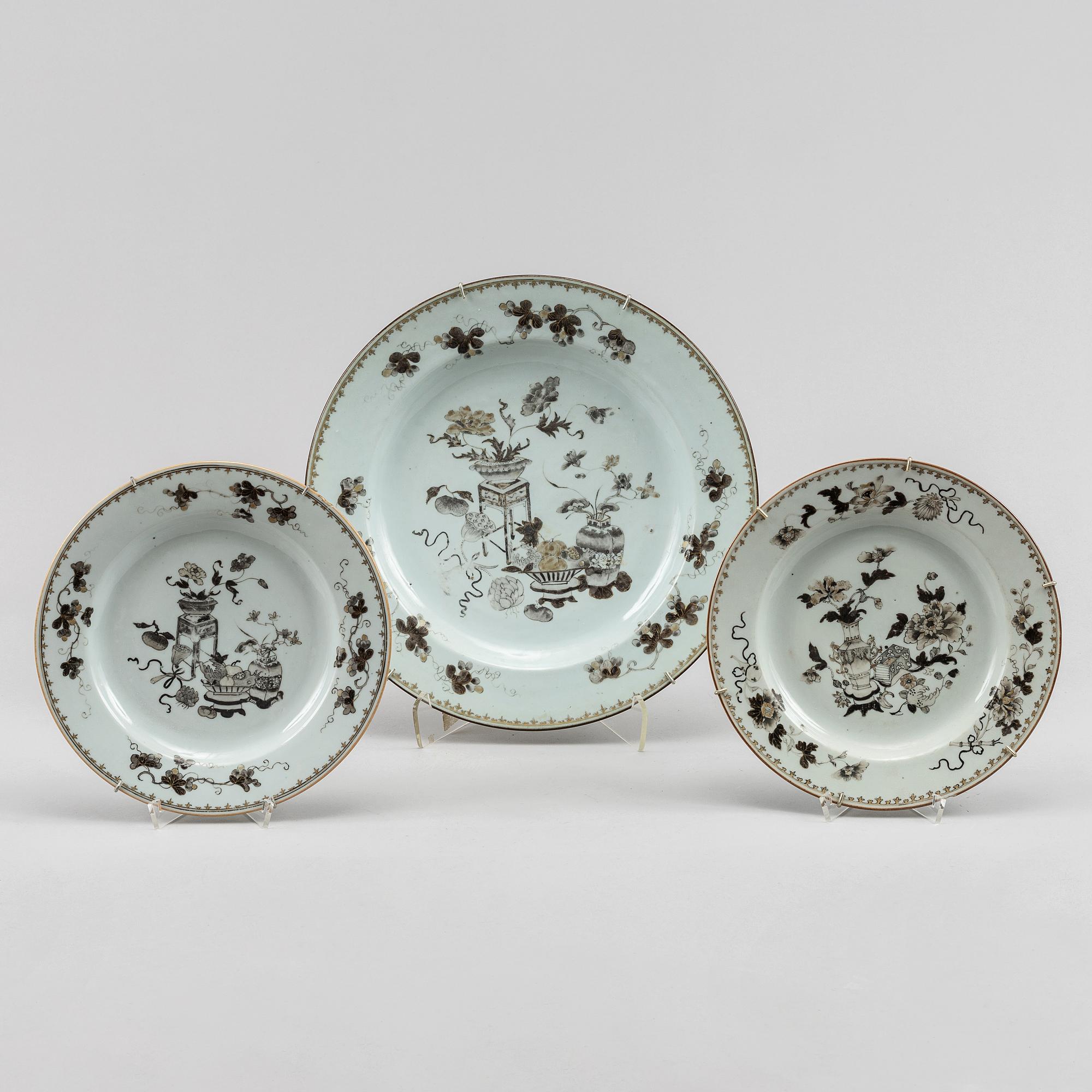 A grisaille dish and two plates, Qing dynasty, Qianlong (1736-95).