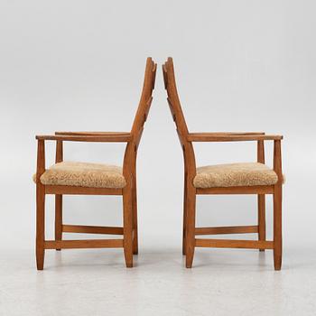 Henning Kjærnulf, a pair of oak 'Razorblade' armchairs with new sheepskin upholstery, from EGK, Demark, 1960s.