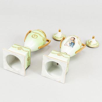 A pair of porcelain urns, possibly naples, first half of the 20th century.