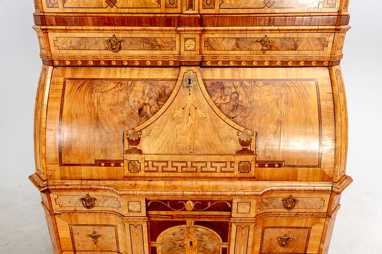 A German walnut and mahogany writing cabinet around 1800.