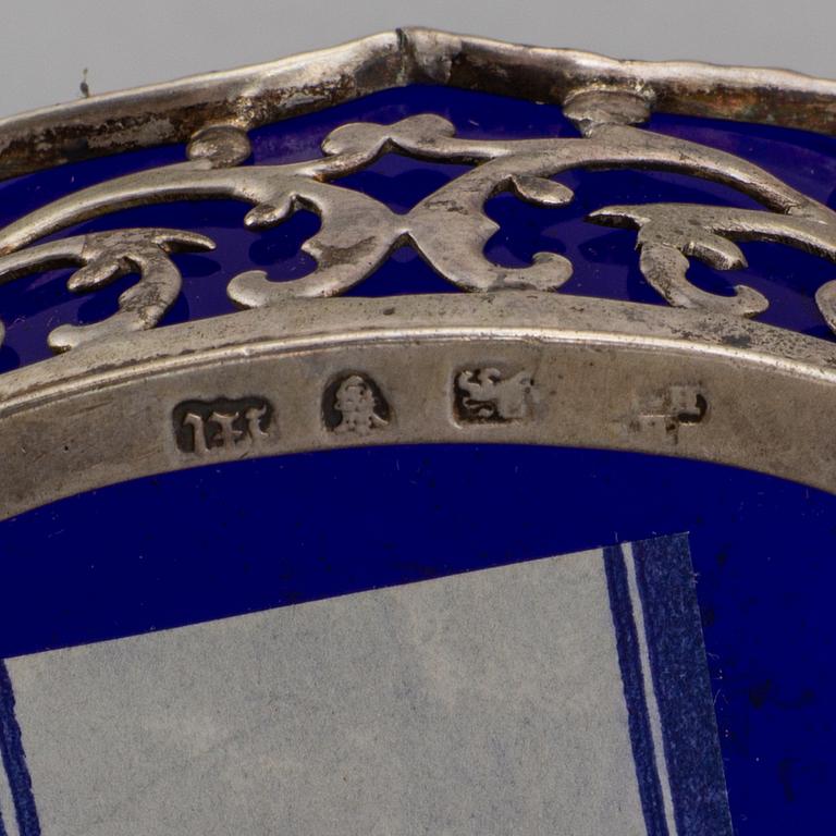 A pair of English 18th century silver and blue glass salt-cellars, unidentified makers mark, London 1767.