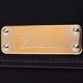 PLÅNBOK, Gucci.