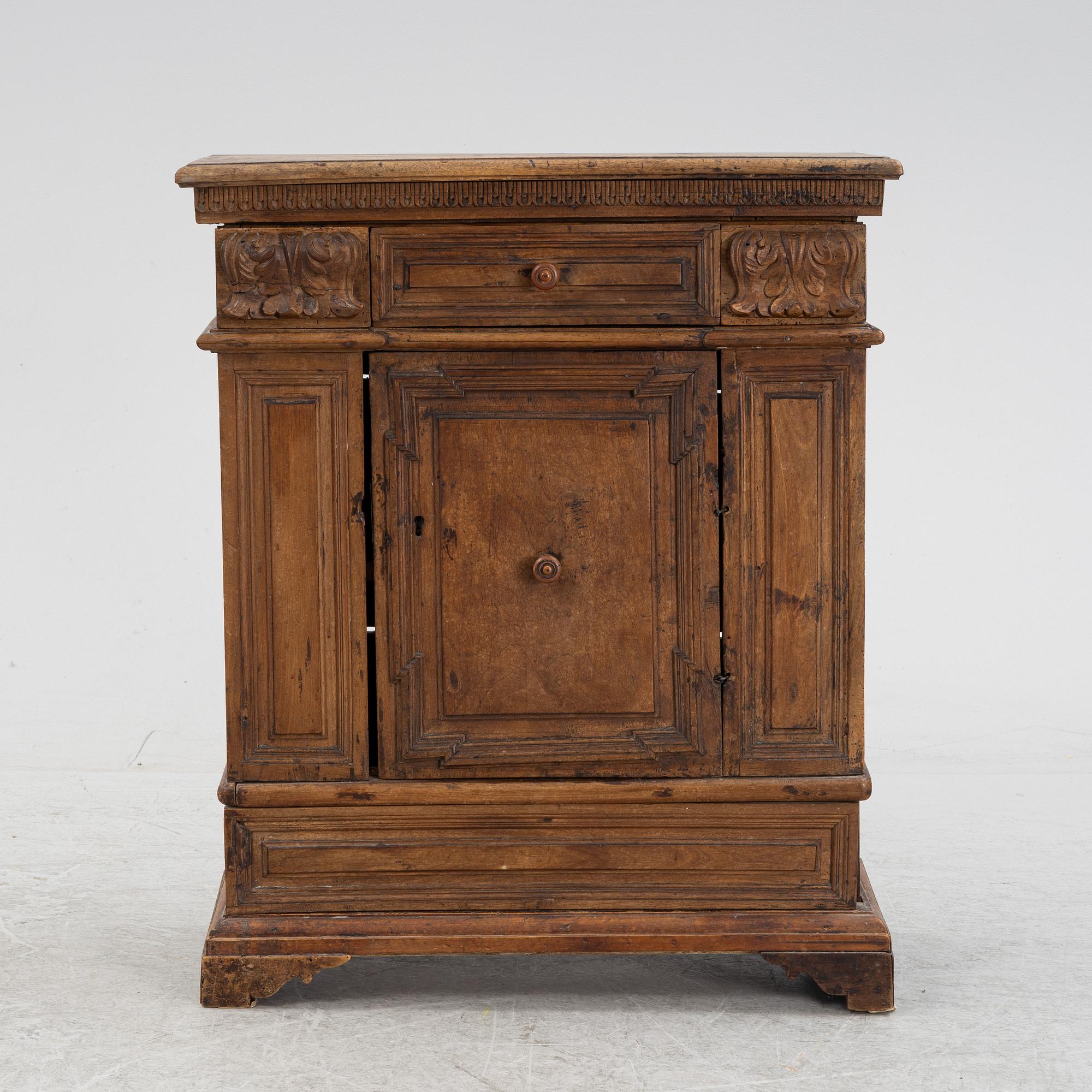A Baroque style cabinet, circa 1900 with older parts.