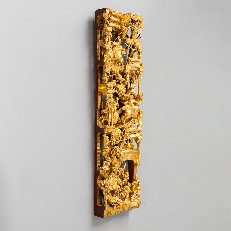 A Chinese carved and gilt wood panel, 20th century.