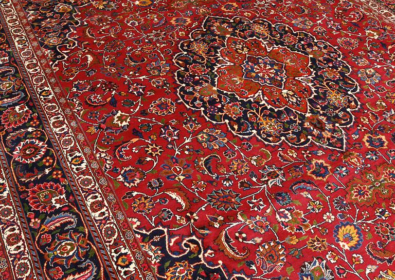 A signed Mashad carpet, ca 375 x 303 cm.