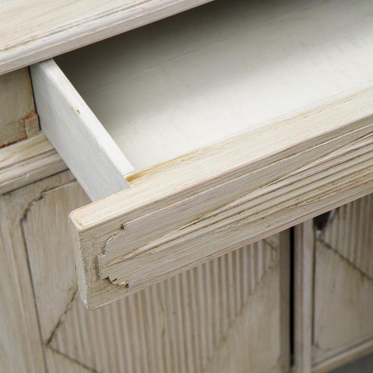 A pair of Gustavian style bedside tables, first half of the 20th century,.