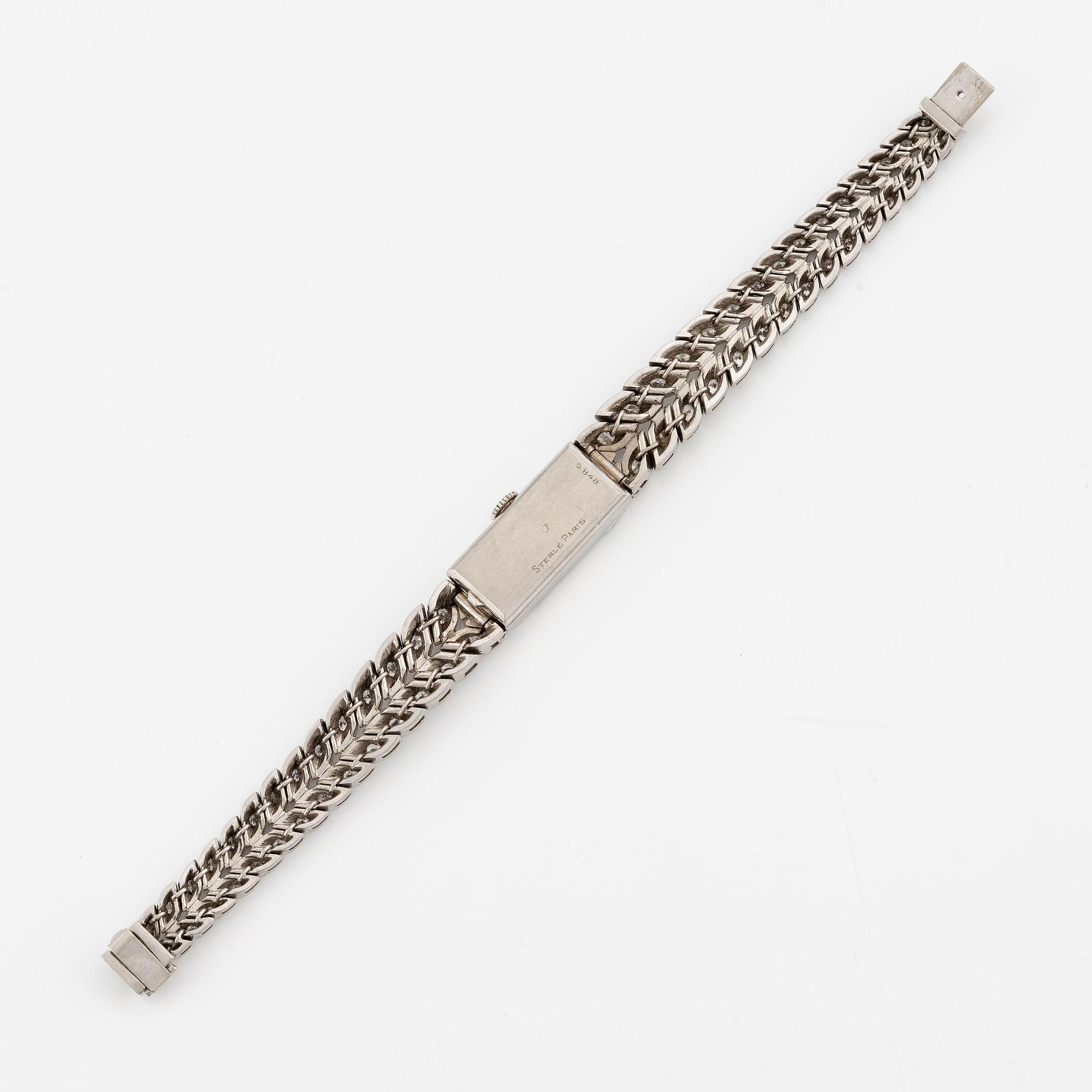 Sterlé armbandsur platina med runda briljantslipade diamanter.