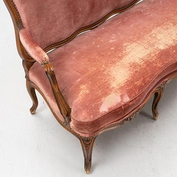 A rococo style sofa, end of the 20th Century.