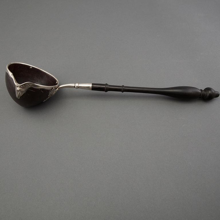 A silver and coconut rococo soup spoon, Sweden 18th century, marked LS.