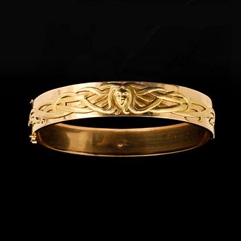 ARMRING, 18k guld. Gunnar Fahlström, Stockholm 1964. Monteringar Jugend, franska stpl. Vikt 29,5 g.