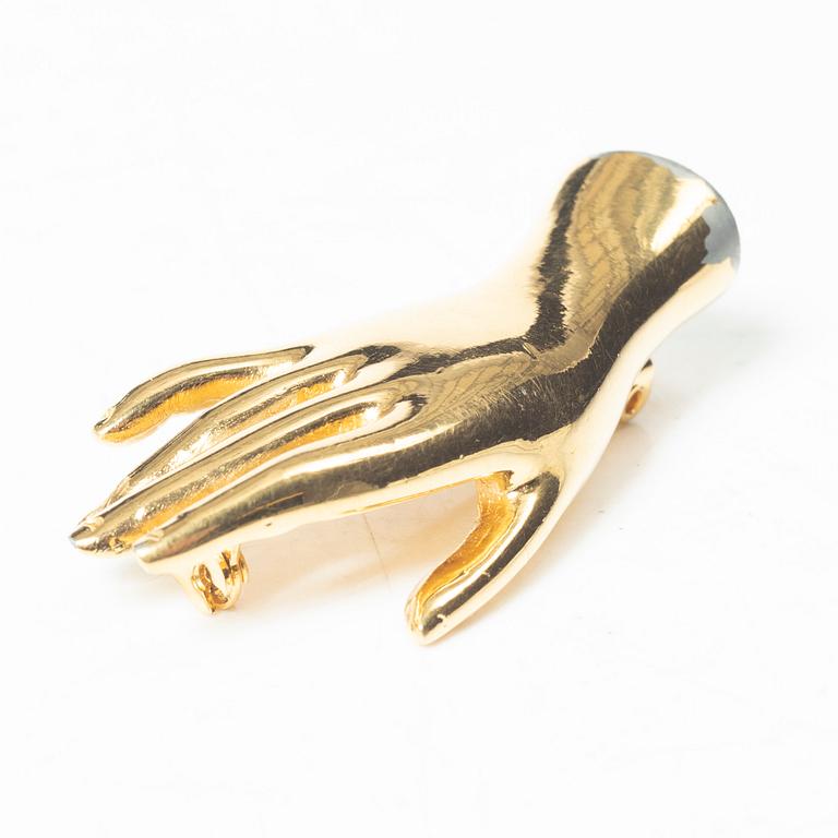 Estrid Ericson, a brooch.