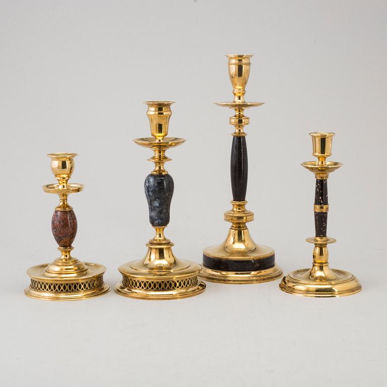 CARL HJALMAR NORRSTRÖM, after. Four brass and stone candlesticks from Skultuna, numbered 161/300, 1997.