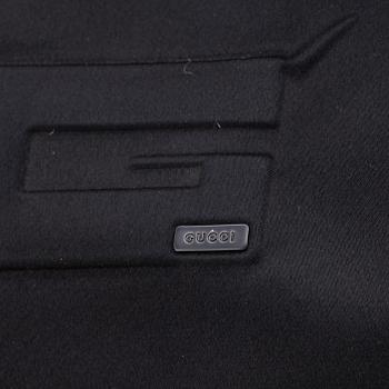 Gucci, a black satin handbag.