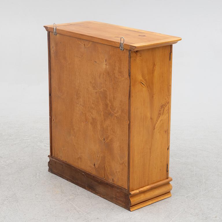 A small wall cabinet, around 1900.