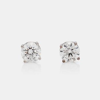 A pair of brilliant cut diamond earrings. The diamonds are 1.00ct and 1.00ct with quality G/VVS2.