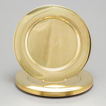 Eight brass plates by Stelton, Denmark, second half of the 20th century.