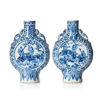 1152. A pair of blue and white moon flasks, Qing dynasty, 19th Century.