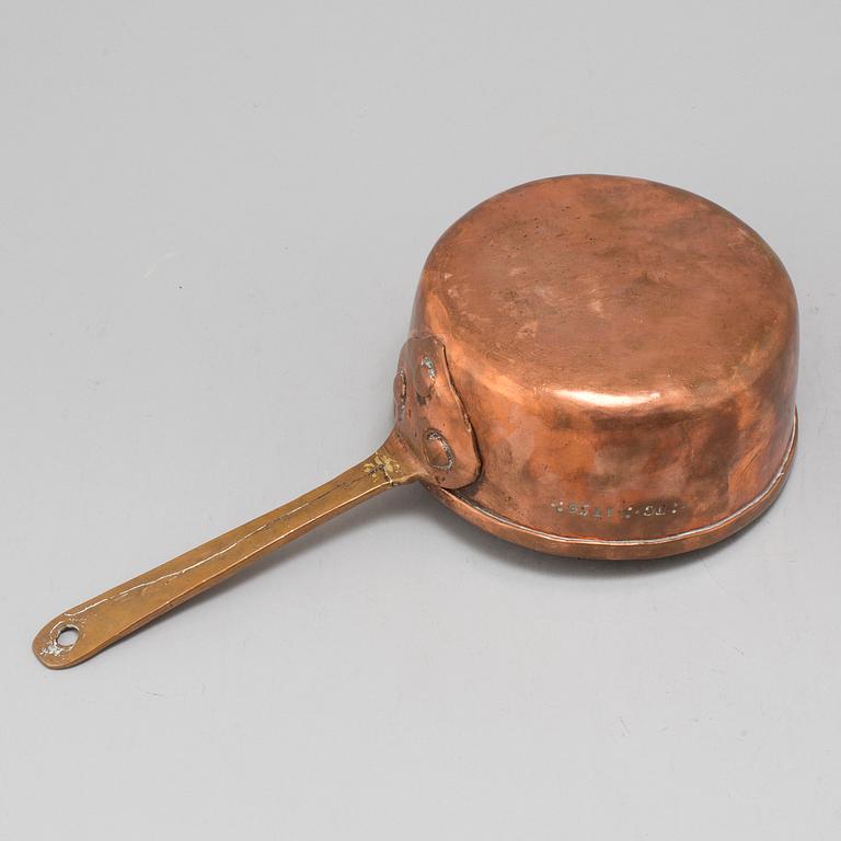 A copper saucepan marked FG 1756.