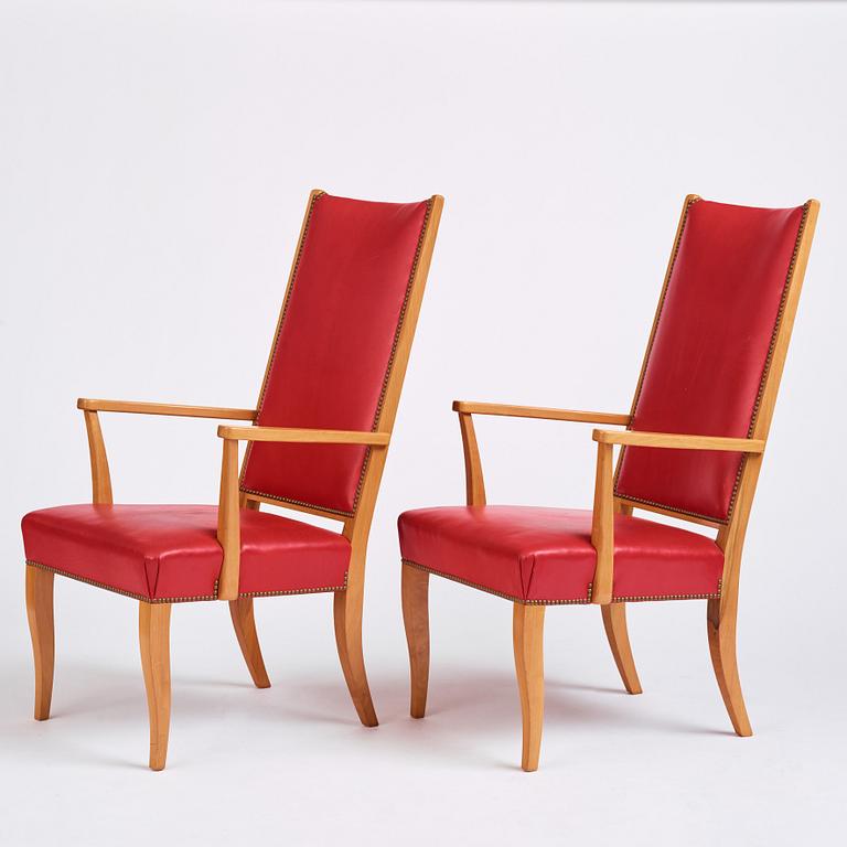 Josef Frank, a pair of walnut and red leather easy chairs, Svenskt Tenn, Sweden 1940-60s.