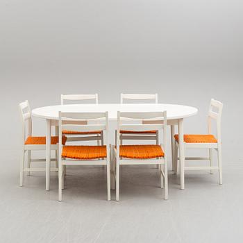 A 1960s dining table with chairs.