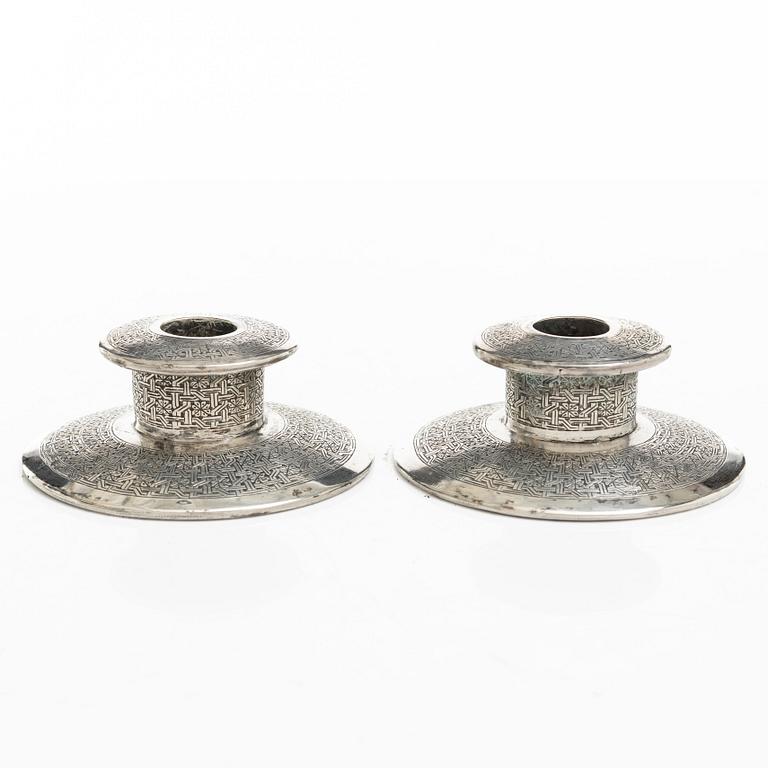 Two pairs of Persian silver candle holders, 20th century.