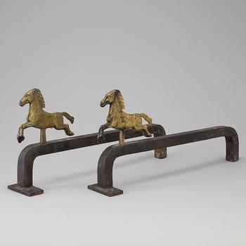 A PAIR OF IRON AND BRASS ANDIRONS by Tore Kullander, Borås 1943.
