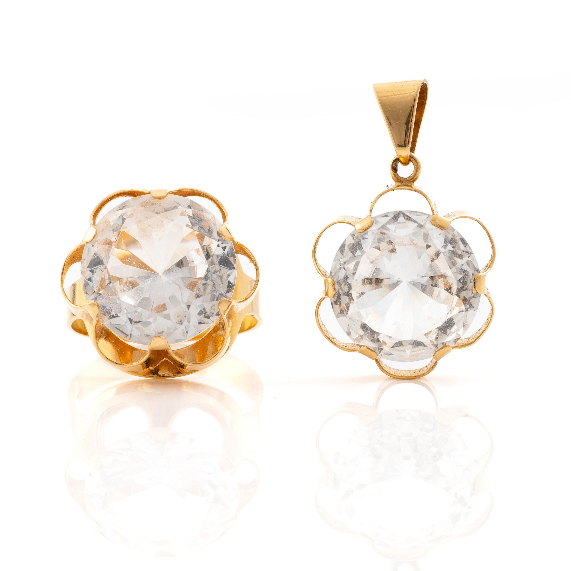 Ring and pendant, 18K gold with synthetic white stones.