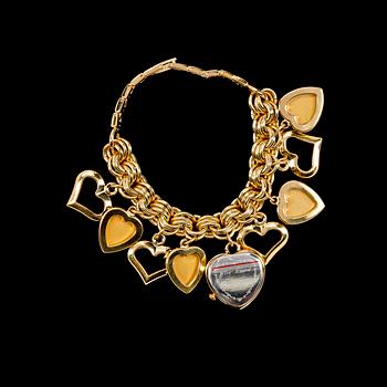 A bracelet with a watch by Betsey Johnson.