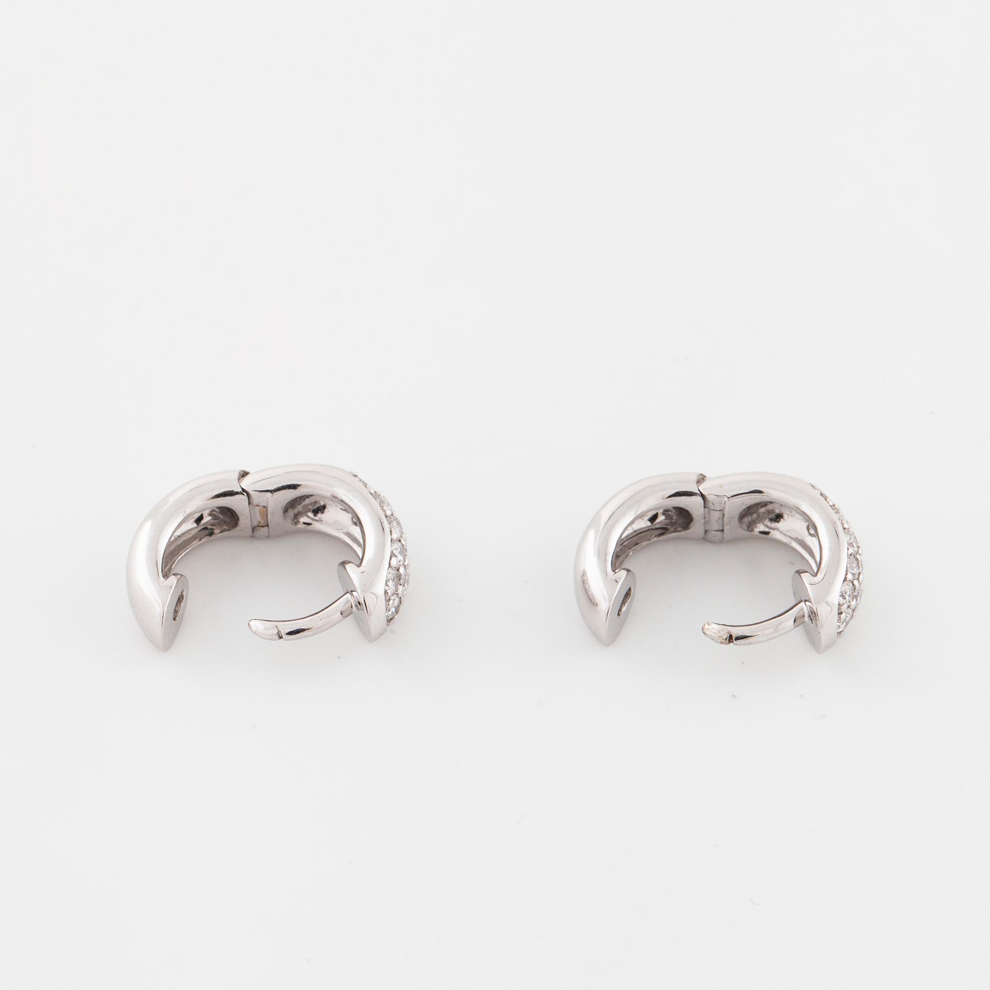 A pair of brilliant cut diamond earrings..