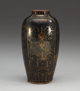 A gilt black vase, Qing dynasty, 18th Century, with Kangxis six character mark.