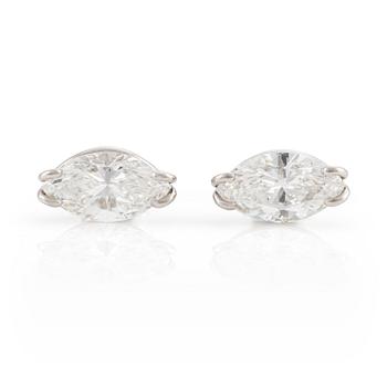524. A pair of 18K white gold Chopard earrings set with two marquise-shaped diamonds.