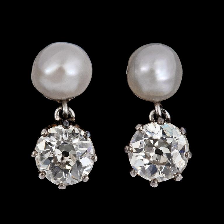 A pair of old cut diamond, tot. 0.90 cts,  and natural pearl earrings.