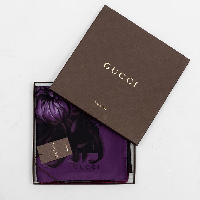 Gucci, a silk scarf.