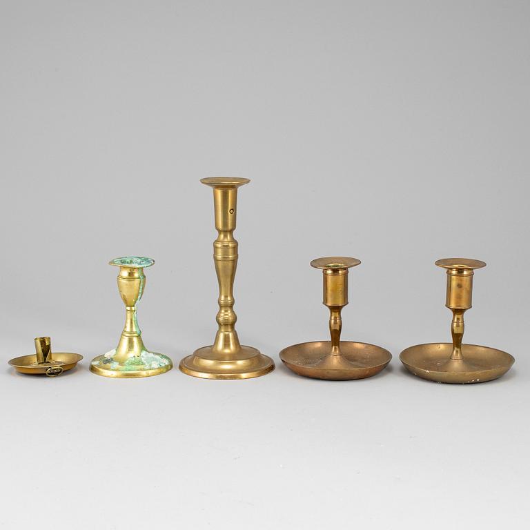 Five brass candlesticks, 18th/19th century.