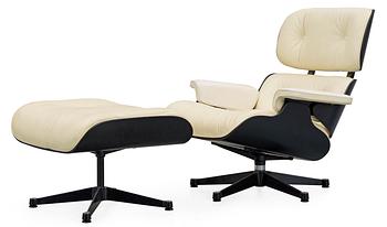 A Charles & Ray Eames white leather "Lounge Chair and ottoman", Vitra.