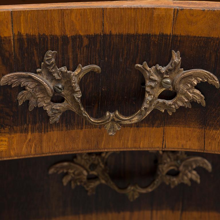 A 19th century Baroque style oak chest of drawers.