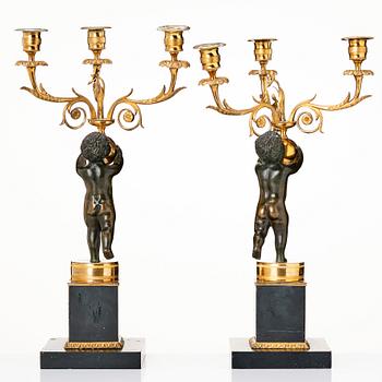 A pair of late Gustavian candelabra.